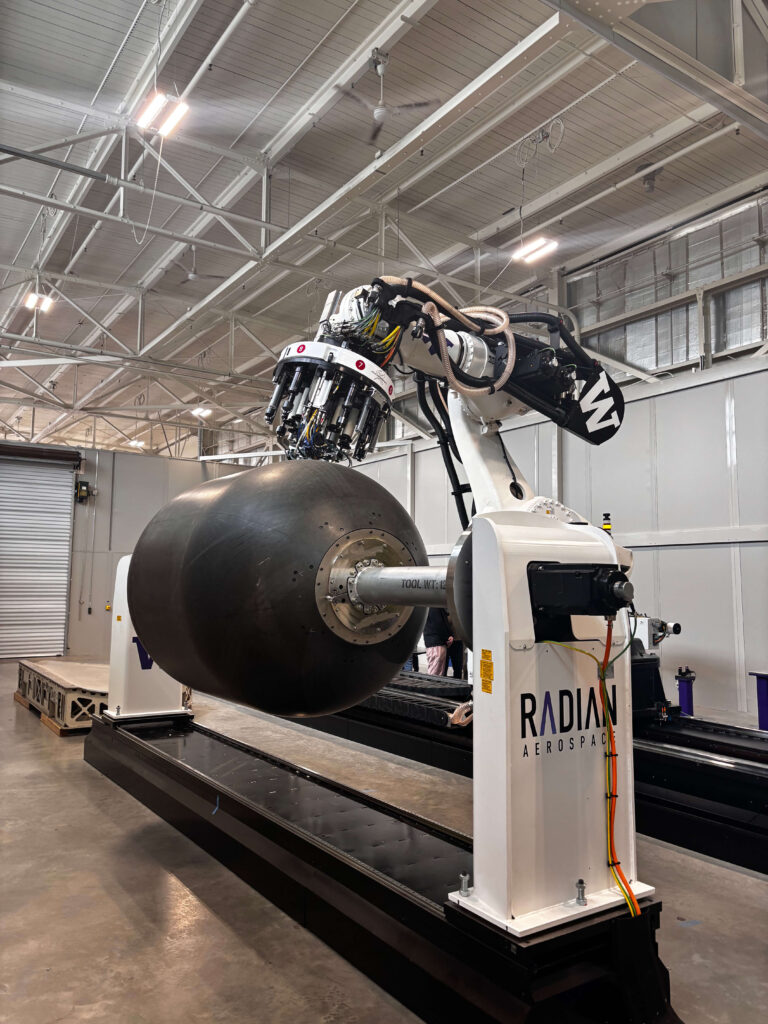 Front view of large piece of robotic equipment with logo on front that reads Radian Aerospace.
