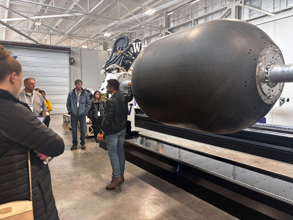 ACC leadership proving a tour of facility equipment.